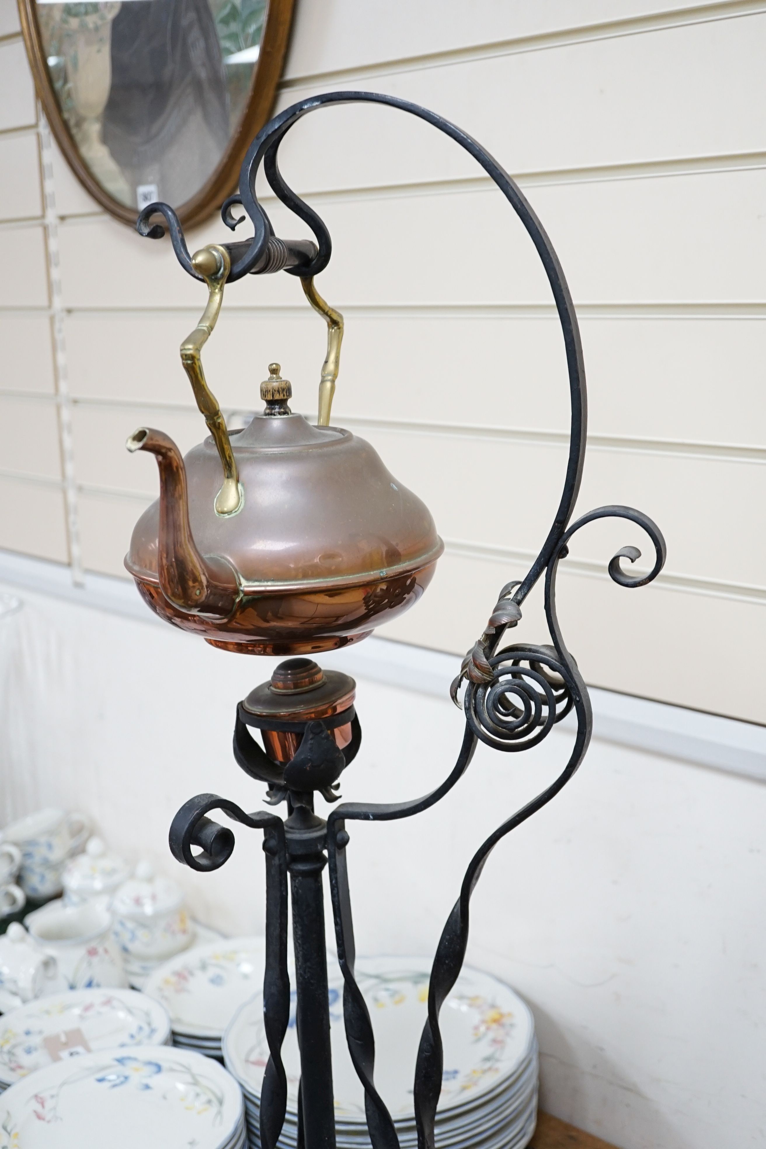 An Arts & Crafts wrought iron and copper burner stand with associated copper kettle 83cm